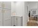 Hallway showing access to kitchen with white and gray cabinets at 94 Glenn Se St, Atlanta, GA 30312