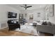 Bright living room featuring modern furnishings, hardwood floors, and a large-screen TV at 94 Glenn Se St, Atlanta, GA 30312