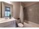 Bathroom featuring a shower-tub combo with a white vanity and toilet at 10143 Windalier Way, Roswell, GA 30076