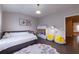 View of bedroom with hardwood floors, area rug, and updated lighting at 10143 Windalier Way, Roswell, GA 30076