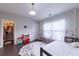 Comfortable bedroom with large windows, curtains, and walk-in closet at 10143 Windalier Way, Roswell, GA 30076