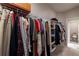 Spacious walk-in closet with abundant hanging space and shelving for organization at 10143 Windalier Way, Roswell, GA 30076