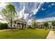 Well-maintained community center with lush green lawn and sidewalk at 10143 Windalier Way, Roswell, GA 30076
