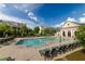 Resort-style community pool with plenty of seating and meticulously manicured landscaping at 10143 Windalier Way, Roswell, GA 30076