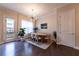 Bright dining room with a modern chandelier, large window, and access to an outdoor deck at 10143 Windalier Way, Roswell, GA 30076