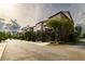 View of townhomes with rear garages and balconies at 10143 Windalier Way, Roswell, GA 30076