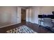 Functional home office with hardwood floors and view to other rooms at 10143 Windalier Way, Roswell, GA 30076