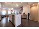 Modern kitchen island with pendant lighting, stainless steel dishwasher, and hardwood floors at 10143 Windalier Way, Roswell, GA 30076