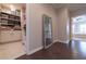 Functional laundry room with storage cabinets, washer, dryer, and access to a bedroom at 10143 Windalier Way, Roswell, GA 30076