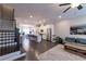 Bright open-concept living space with kitchen island and staircase in view at 10143 Windalier Way, Roswell, GA 30076