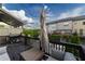 Cozy deck with a built-in grill, comfortable seating, and a closed patio umbrella at 10143 Windalier Way, Roswell, GA 30076