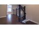 Elegant staircase with dark wood steps and railing, leading to an upper level at 10143 Windalier Way, Roswell, GA 30076