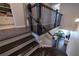 Elegant staircase featuring dark wood steps and railings, leading to a bright living area at 10143 Windalier Way, Roswell, GA 30076
