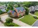 Stunning aerial view of the brick home, highlighting its mature landscaping and neighborhood setting at 1402 Bromley Dr, Snellville, GA 30078