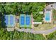 Overhead shot of neighborhood amenities including a swimming pool, tennis courts, and a pickleball court at 1402 Bromley Dr, Snellville, GA 30078