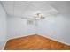 Basement bedroom featuring a ceiling fan, laminate wood flooring and a window at 1402 Bromley Dr, Snellville, GA 30078