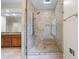Luxurious bathroom featuring a glass shower with multiple shower heads and decorative tile at 1402 Bromley Dr, Snellville, GA 30078