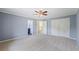 Bedroom with an ensuite bathroom, a ceiling fan, and a large double-door closet at 1402 Bromley Dr, Snellville, GA 30078