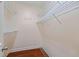 Walk-in closet with hanging racks and shelving at 1402 Bromley Dr, Snellville, GA 30078