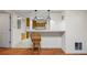 Dining area with wooden bar stool and light fixtures at 1402 Bromley Dr, Snellville, GA 30078