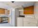 Kitchen with modern appliances next to laundry area at 1402 Bromley Dr, Snellville, GA 30078