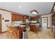 Open kitchen with granite countertops, stainless steel appliances, and breakfast bar at 1402 Bromley Dr, Snellville, GA 30078