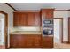 Well-lit kitchen with stainless steel appliances and granite countertops at 1402 Bromley Dr, Snellville, GA 30078