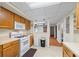 Full kitchen view includes modern appliances, plenty of cabinetry, and smooth transition to other parts of the house at 1402 Bromley Dr, Snellville, GA 30078