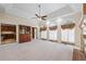 Open-concept living room with fireplace and access to the kitchen at 1402 Bromley Dr, Snellville, GA 30078