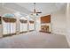 Bright living room featuring a fireplace and large arched windows at 1402 Bromley Dr, Snellville, GA 30078