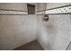 Modern shower featuring sleek gray tiling, hexagon floor, and convenient built-in niche at 1402 Bromley Dr, Snellville, GA 30078