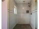 Tiled walk-in shower featuring a mosaic accent stripe and dual shower heads at 1402 Bromley Dr, Snellville, GA 30078