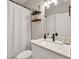 Bright bathroom with white cabinets, modern fixtures, and shower at 1584 Heartland Path, Hoschton, GA 30548