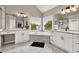 Large bathroom with a soaking tub, double vanity sinks, and marble tile floors at 1584 Heartland Path, Hoschton, GA 30548