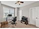 Well-lit room with a window, and a comfortable chair, creating a relaxing atmosphere for work and relaxation at 1584 Heartland Path, Hoschton, GA 30548