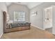 Bright bedroom with a large window and a comfortable bed, offering a peaceful retreat for rest and relaxation at 1584 Heartland Path, Hoschton, GA 30548