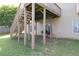 View of the stairs leading from a raised wooden deck to the large backyard and grilling area at 1584 Heartland Path, Hoschton, GA 30548