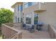 A cozy outdoor deck with patio furniture and a grill, perfect for enjoying a meal at 1584 Heartland Path, Hoschton, GA 30548