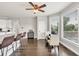 Dining area with a view, hardwood flooring, and modern light fixtures at 1584 Heartland Path, Hoschton, GA 30548