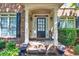 Inviting front porch with decorative plants and charming home decor at 1584 Heartland Path, Hoschton, GA 30548