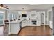Bright, modern kitchen featuring granite countertops, stainless steel appliances and hardwood floors at 1584 Heartland Path, Hoschton, GA 30548