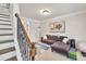 Cozy living room with a comfortable couch, stylish decor, and great natural light at 1584 Heartland Path, Hoschton, GA 30548