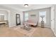 Inviting living room with sofa, natural light, and carpet at 1584 Heartland Path, Hoschton, GA 30548