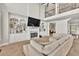 Bright living area with fireplace and access to more rooms upstairs at 1584 Heartland Path, Hoschton, GA 30548