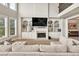 Inviting living space featuring built-in shelves and a cozy fireplace at 1584 Heartland Path, Hoschton, GA 30548