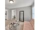 Bright living room featuring modern furniture and a decorative mirror for added style at 1584 Heartland Path, Hoschton, GA 30548
