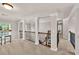 Open loft area with classic railings, archways and carpeted floor at 1584 Heartland Path, Hoschton, GA 30548