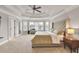 Spacious main bedroom with large windows and cozy reading nook at 1584 Heartland Path, Hoschton, GA 30548