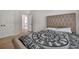 Carpeted primary bedroom with neutral colors and light walls at 1584 Heartland Path, Hoschton, GA 30548