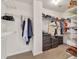 Spacious walk-in closet with custom shelving and ample storage space at 1584 Heartland Path, Hoschton, GA 30548